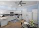 Well-appointed kitchen featuring sleek white cabinets, modern appliances, and a breakfast nook at 7427 20Th St, Zephyrhills, FL 33540