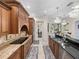 The kitchen offers a view of stainless steel appliances, granite countertops, and tile flooring at 7427 20Th St, Zephyrhills, FL 33540