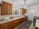 This spacious laundry room features custom cabinetry and ample counter space at 7427 20Th St, Zephyrhills, FL 33540