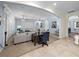 Open living space with a cozy seating area, an office nook, and beautiful tile and carpet flooring at 7427 20Th St, Zephyrhills, FL 33540