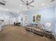 Well-lit living room boasts a spacious layout, neutral decor, and a cozy seating area at 7427 20Th St, Zephyrhills, FL 33540
