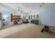 Open-concept living area with ample seating, natural light, and seamless flow to the kitchen at 7427 20Th St, Zephyrhills, FL 33540