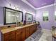 Spacious main bathroom with double sinks, walk-in shower and modern fixtures at 7427 20Th St, Zephyrhills, FL 33540