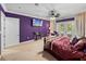 Cozy main bedroom features a ceiling fan, access to the pool, and ample natural light at 7427 20Th St, Zephyrhills, FL 33540