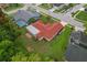Overhead shot of the property showcasing the yard and street, plus nearby homes at 8671 Cypress Lakes Blvd, New Port Richey, FL 34653