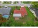 Aerial view of the property showcasing the backyard patio and neighborhood at 8671 Cypress Lakes Blvd, New Port Richey, FL 34653