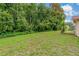 The spacious backyard offers plenty of room for outdoor activities and relaxation at 8671 Cypress Lakes Blvd, New Port Richey, FL 34653