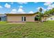 Lush backyard with well-maintained lawn and patio at 8671 Cypress Lakes Blvd, New Port Richey, FL 34653