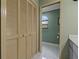 Cozy bathroom featuring tile floors and a window for natural light at 8671 Cypress Lakes Blvd, New Port Richey, FL 34653