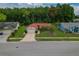 Charming single Gathering home featuring a well-manicured lawn, mature landscaping, and a two-car garage at 8671 Cypress Lakes Blvd, New Port Richey, FL 34653
