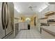 Spacious kitchen features stainless steel appliances, ample cabinetry, and bright lighting at 8671 Cypress Lakes Blvd, New Port Richey, FL 34653