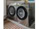 Laundry room with stainless steel, front-load Samsung washer and dryer at 8671 Cypress Lakes Blvd, New Port Richey, FL 34653