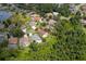 Aerial view of a home featuring a private pool and a well-maintained backyard at 9206 Brindlewood Dr, Odessa, FL 33556