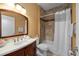 Cozy bathroom featuring a vanity and a shower over tub at 9206 Brindlewood Dr, Odessa, FL 33556