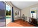 Bedroom with view of pool, plantation shutters, lots of light, and hardwood floors at 9206 Brindlewood Dr, Odessa, FL 33556