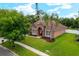 Well-maintained single Gathering house on a large lot with mature trees and a lush green lawn at 9206 Brindlewood Dr, Odessa, FL 33556