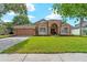 Attractive home with a well-manicured lawn, tidy landscaping, and a charming, inviting facade at 9206 Brindlewood Dr, Odessa, FL 33556
