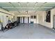 Spacious garage featuring ample storage cabinets, and a well-lit interior at 9206 Brindlewood Dr, Odessa, FL 33556