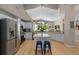 Bright kitchen featuring stainless steel appliances, a center island, and a breakfast nook at 9206 Brindlewood Dr, Odessa, FL 33556