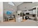 Large kitchen with white cabinets, stainless appliances, an island, and an adjacent dining area at 9206 Brindlewood Dr, Odessa, FL 33556
