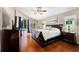 Comfortable main bedroom featuring a king-sized bed, private outdoor access, and lots of natural light at 9206 Brindlewood Dr, Odessa, FL 33556