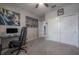 Bedroom with a ceiling fan, neutral carpet and walls, and ample closet space provides comfort and functionality at 9672 Ivory Dr, Ruskin, FL 33573