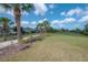 A large green space with a sidewalk that is perfect for community recreation and leisurely strolls at 9672 Ivory Dr, Ruskin, FL 33573