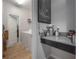 This laundry room features granite countertops, tiled flooring, and modern washer and dryer units at 9672 Ivory Dr, Ruskin, FL 33573