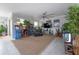 Spacious living area featuring unique arcade games, modern decor, and a cozy oversized chair at 9672 Ivory Dr, Ruskin, FL 33573
