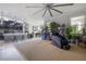 Open-concept living area flowing into the kitchen, complete with entertainment and unique furnishings at 9672 Ivory Dr, Ruskin, FL 33573