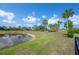 A community pond and park offers residents a peaceful outdoor space at 9672 Ivory Dr, Ruskin, FL 33573