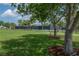 A well-maintained community tennis court surrounded by lush greenery at 9672 Ivory Dr, Ruskin, FL 33573