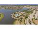 Aerial view of the community amenities including pool, tennis, and playground at 9814 Quadrangle Ct, Sun City Center, FL 33573