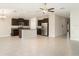 The kitchen features stainless steel appliances, a central island, and dark wood cabinetry at 9814 Quadrangle Ct, Sun City Center, FL 33573