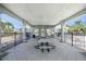 Spacious outdoor pavilion featuring multiple picnic tables, ceiling fans, and an open-air design for community gatherings at 9814 Quadrangle Ct, Sun City Center, FL 33573