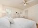 Inviting bedroom featuring neutral tones, plantation shutters and a plush bed at 3078 Eastland Blvd # 205, Clearwater, FL 33761