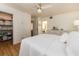 Bedroom featuring a closet, white walls, hardwood floors and ceiling fan at 3078 Eastland Blvd # 205, Clearwater, FL 33761