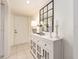 The tiled foyer showcases an attractive mirror over a cabinet, creating a stylish and welcoming entryway at 3078 Eastland Blvd # 205, Clearwater, FL 33761