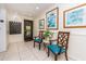 The well-lit hallway features tile flooring, seating, mailboxes and tasteful artwork, for a welcoming ambiance at 3078 Eastland Blvd # 205, Clearwater, FL 33761
