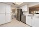 Contemporary kitchen design with stainless steel appliances and bright white cabinetry at 3078 Eastland Blvd # 205, Clearwater, FL 33761