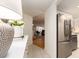 Inviting entryway offers a glimpse into the living room, complete with a stainless steel refrigerator at 3078 Eastland Blvd # 205, Clearwater, FL 33761
