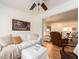 Cozy living room featuring hardwood floors, painting and access to another room at 3078 Eastland Blvd # 205, Clearwater, FL 33761