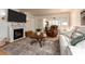Inviting living room with a decorative fireplace and comfortable seating area at 3078 Eastland Blvd # 205, Clearwater, FL 33761