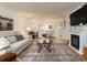 Spacious living room featuring a fireplace and an open floor plan layout at 3078 Eastland Blvd # 205, Clearwater, FL 33761