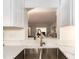 Close-up view of the sink with a view to the open-concept living area at 3078 Eastland Blvd # 205, Clearwater, FL 33761