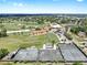 A neighborhood aerial shot highlighting the golf course, tennis courts and other community amenities at 1005 45Th W St, Bradenton, FL 34209