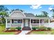 Charming single-story home featuring a welcoming front porch, well-maintained landscaping, and a freshly painted exterior at 1005 45Th W St, Bradenton, FL 34209