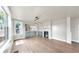 Spacious living room with hardwood floors, stylish lighting, and an open-concept design connecting to the kitchen at 1005 45Th W St, Bradenton, FL 34209