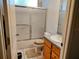 Well-lit bathroom with glass shower door and light-colored vanity at 1006 Tropical Dr, Bradenton, FL 34208