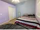 Cozy bedroom featuring carpet floors, closet and a double bed at 1006 Tropical Dr, Bradenton, FL 34208
